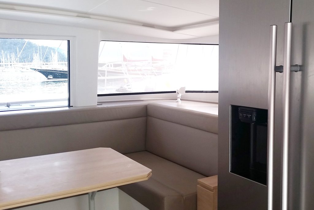 Saloon table in catamaran Bali 4.5 LeAndra for charter in Orhaniye in Turkey