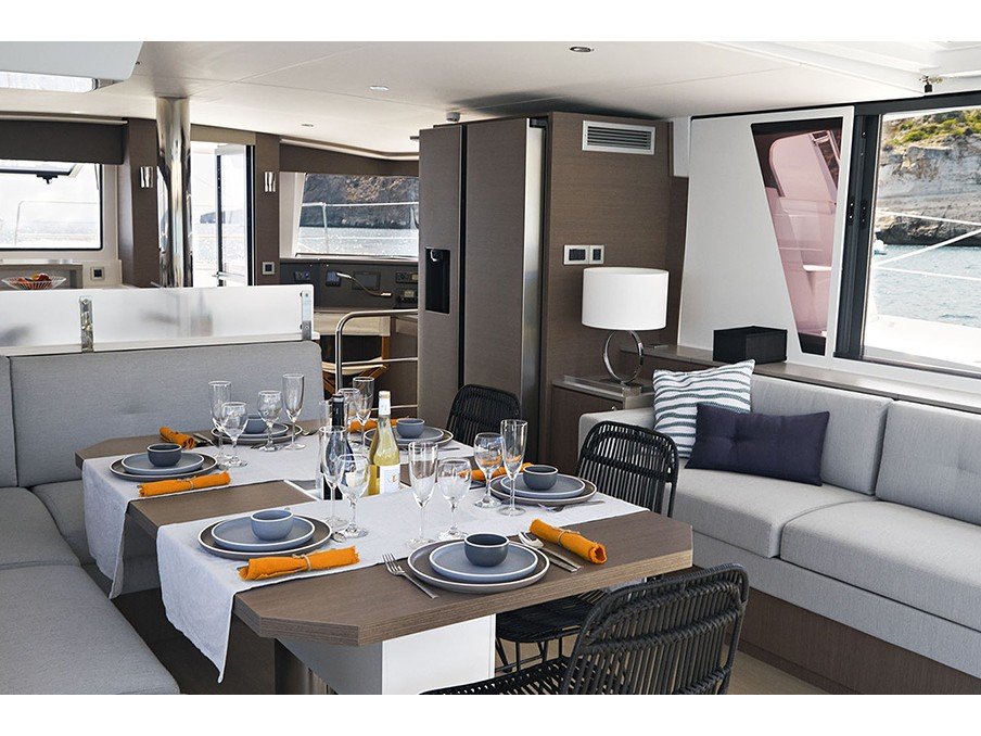 Saloon table in catamaran Bali 4.6 Rhapsody in Blue for charter in Orhaniye near Marmaris in Turkey