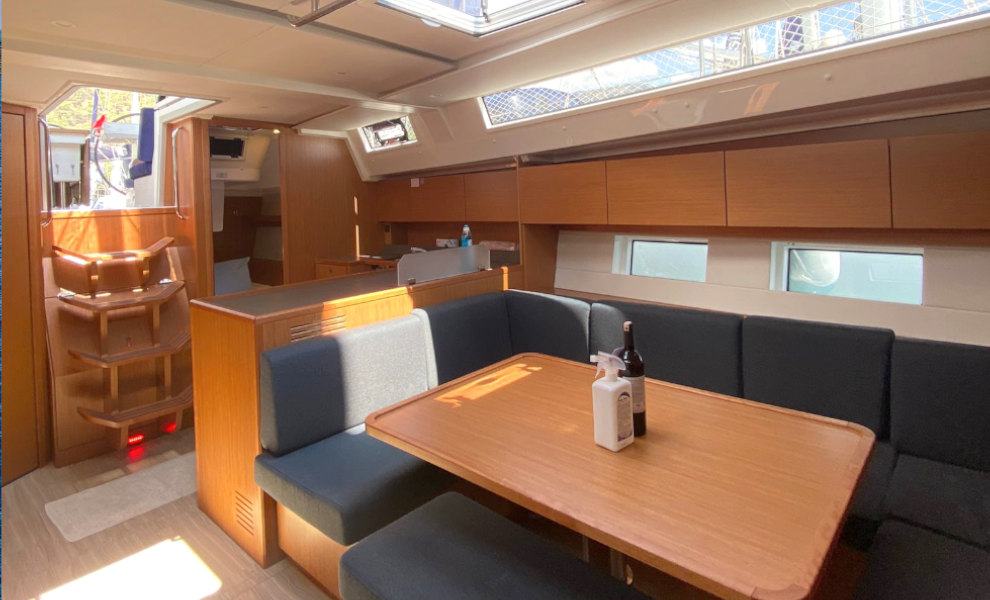 Saloon table in sailing yacht Bavaria C45 Allegro for charter in Göcek in Turkey