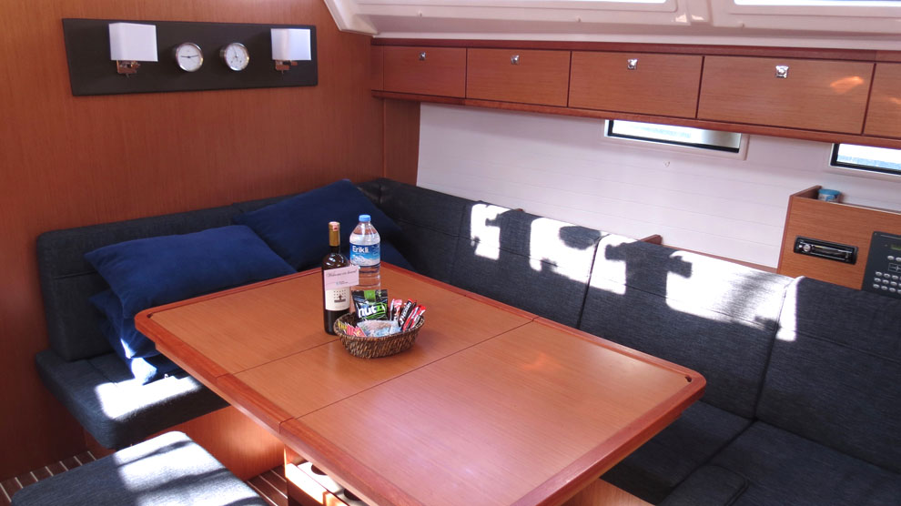 Saloon table in sailing yacht Bavaria Cruiser 46 Sita for charter in Gocek in Turkey