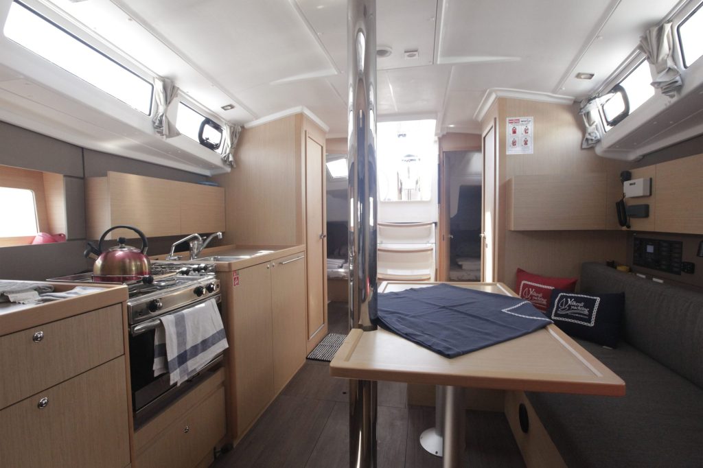 Saloon table in sailing boat Beneteau Oceanis 38.1 Missy for charter in Orhaniye near Marmaris in Turkey