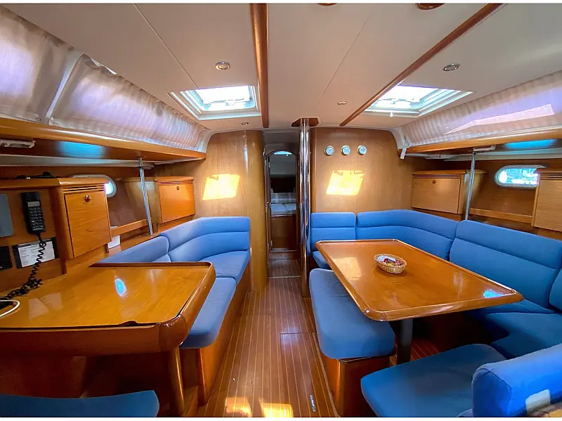 Saloon table in sailing yacht Jeanneau Sun Odyssey 43 Saida for charter in Fethiye in Turkey