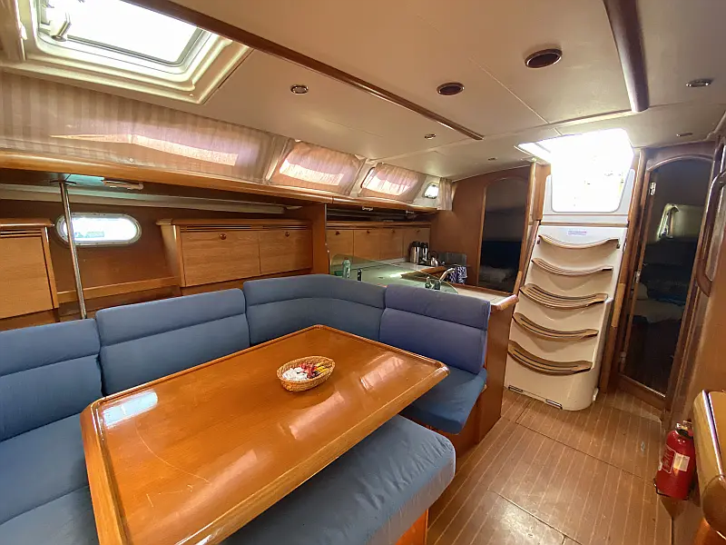 Saloon table in sailing yacht Jeanneau Sun Odyssey 43 Saida for charter in Fethiye in Turkey