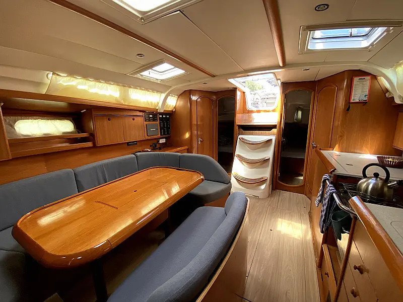Saloon table in sailing yacht Jeanneau Sun Odyssey 45 Safina for charter in Fethiye in Turkey