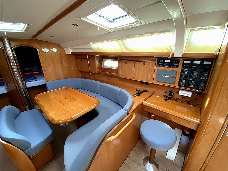 Saloon table in sailing yacht Jeanneau Sun Odyssey 45 Safina for charter in Fethiye in Turkey