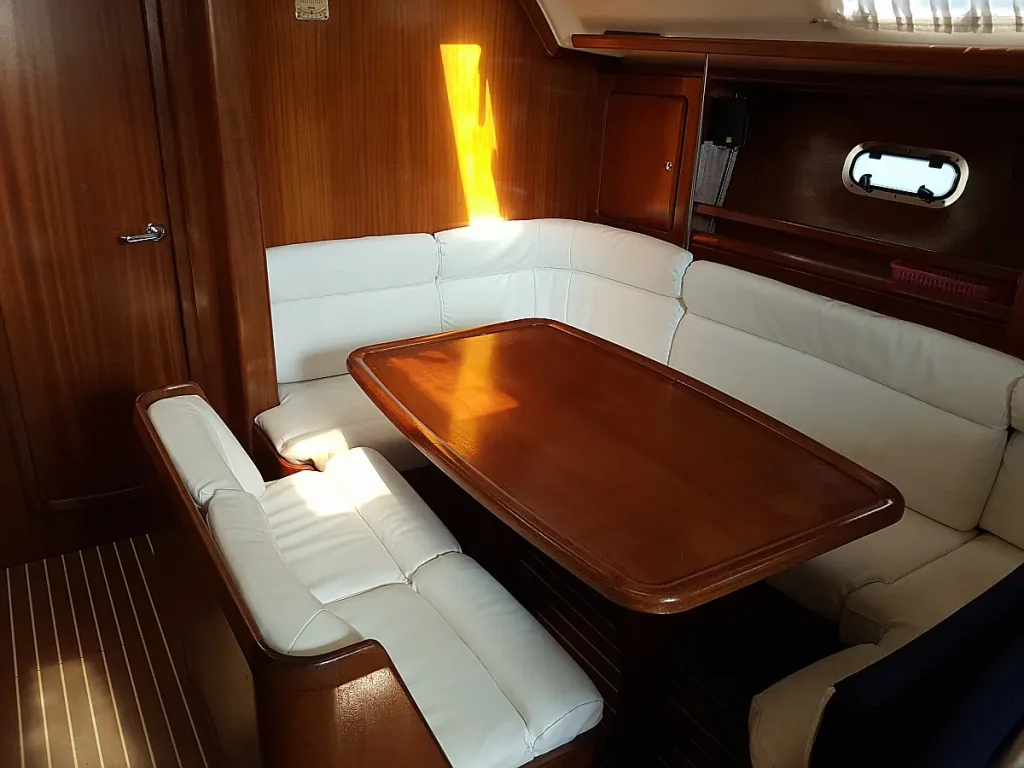 Saloon table in sailing yacht Bavaria 40 Alegria for charter in Corfu in Greece