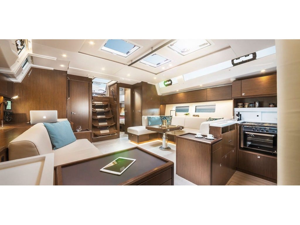 Saloon in sailing yacht Bavaria C57 Style for charter in Lavrion in Greece