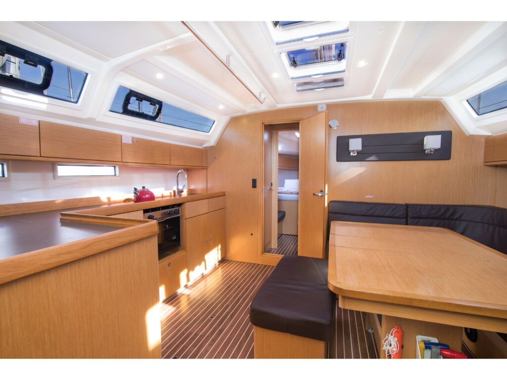 Saloon in sailing yacht Bavaria Cruiser 46 Simbl for charter in Corfu in Greece