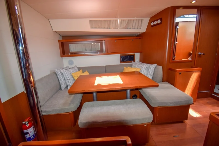 Saloon table in sailing yacht Beneteau Oceanis 45 Tonic in Marmaris in Turkey