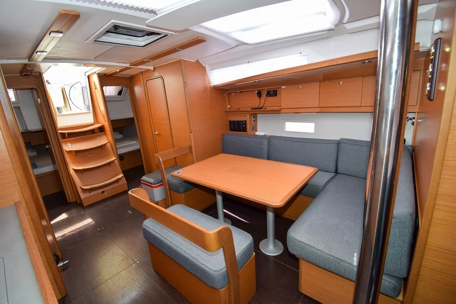 Saloon table in sailing yacht Dufour 430 Grand Large Ida for charter in Marmaris in Turkey