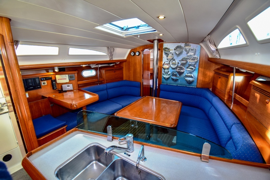 Saloon table in sailing boat Jeanneau Sun Odyssey 37 Kacamak for charter in Marmaris in Turkey
