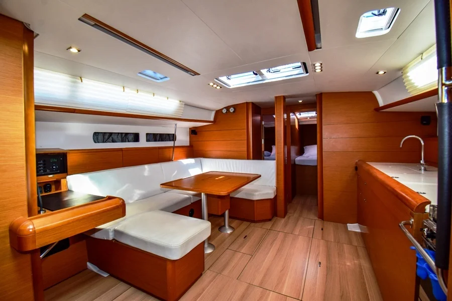 Saloon table in sailing yacht Jeanneau Sun Odyssey 479 Sky Selin for charter in Marmaris in Turkey