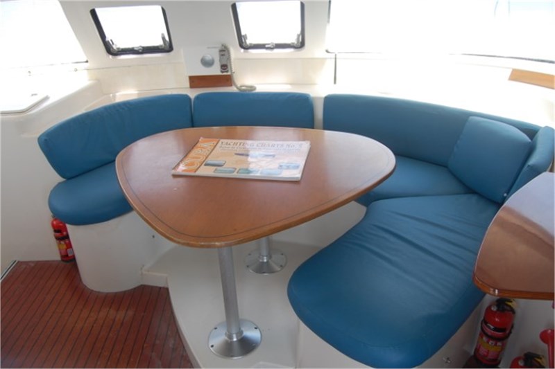 Saloon table in catamaran Fountaine Pajot Lavezzi 40 Kupela for charter in Cuba
