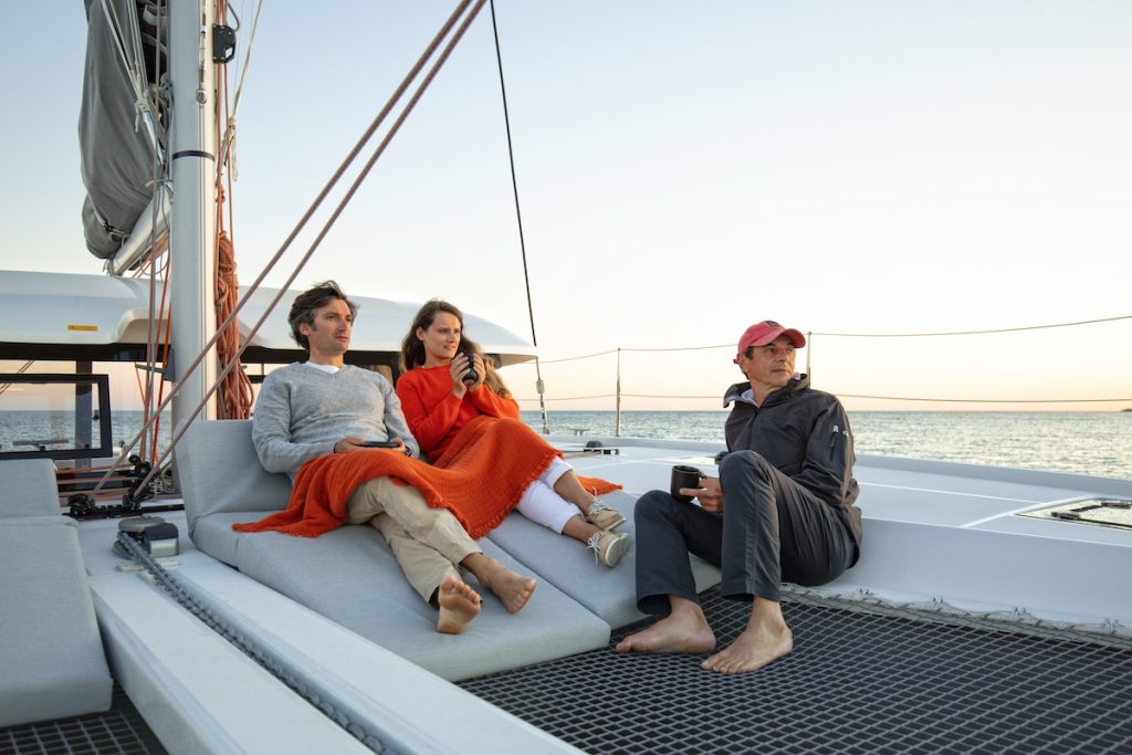 Relaxation on deck of catamaran Excess 11