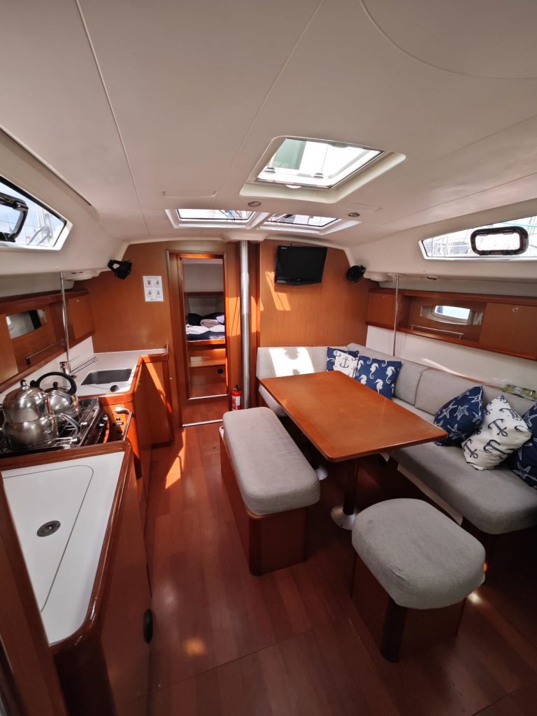 Saloon table in sailing yacht Beneteau Oceanis 43 Lilium for charter in Fethiye in Turkey