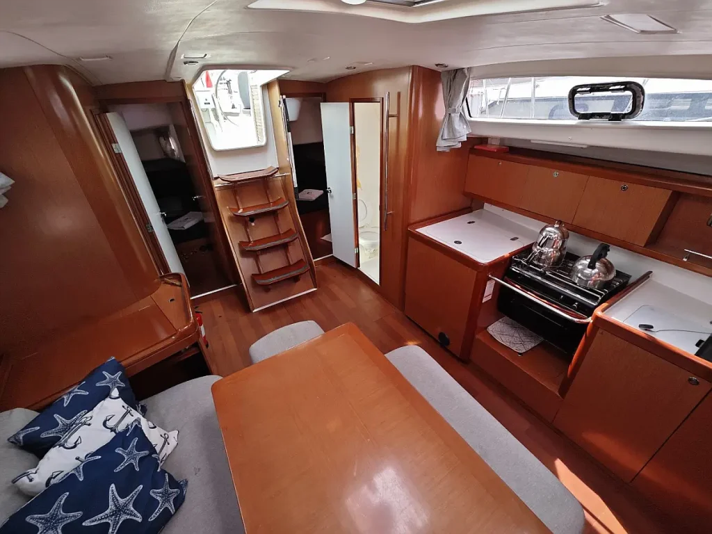 Saloon table in sailing yacht Beneteau Oceanis 43 Lilium for charter in Fethiye in Turkey