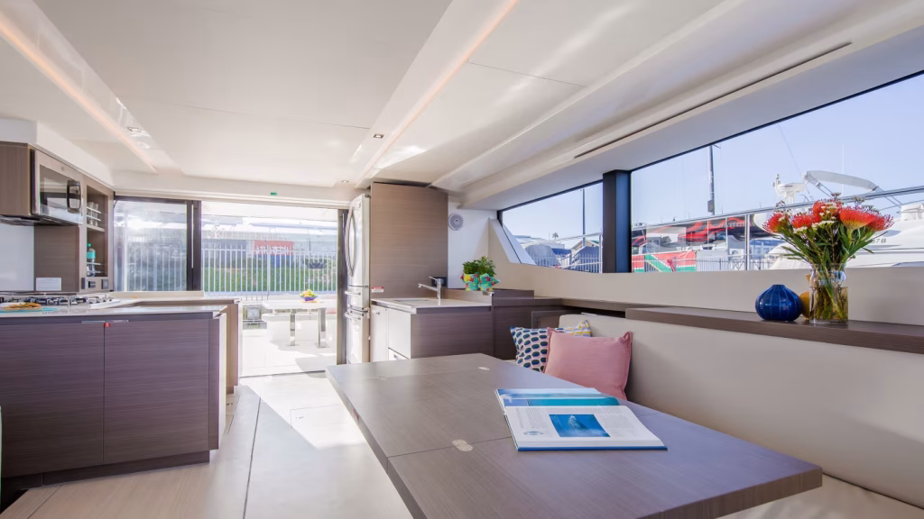 Saloon table in power catamaran Moorings 534 PC for charter in Great Abaco in Bahamas in Caribbean